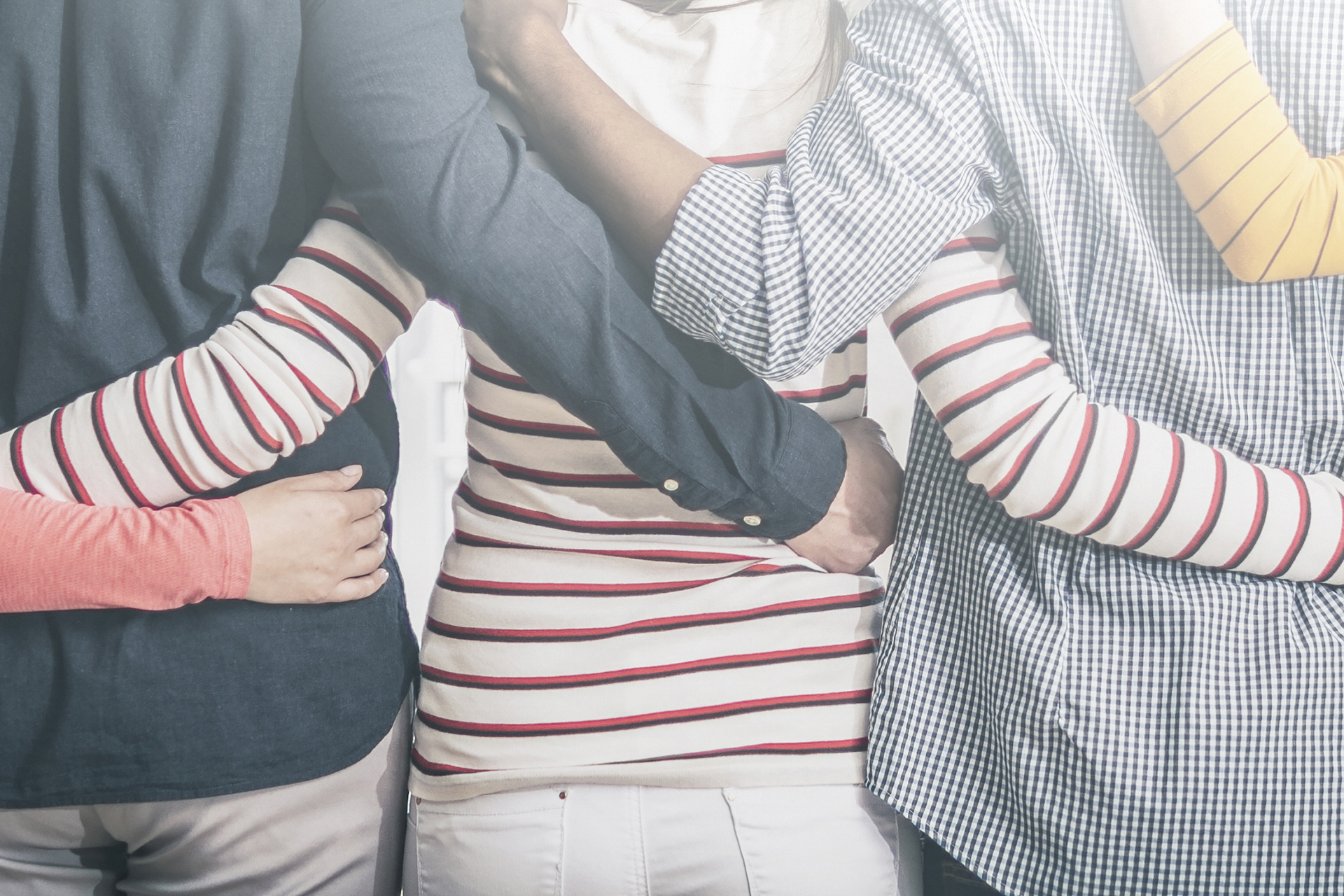 Creative team meeting hands together in line. Young business people are holding hands. Unity and teamwork concept. 