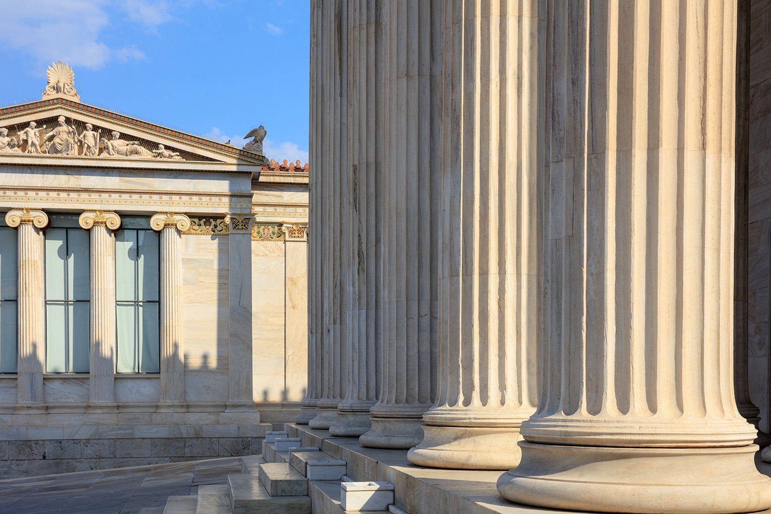 Classical marble pillars on the facade of a building